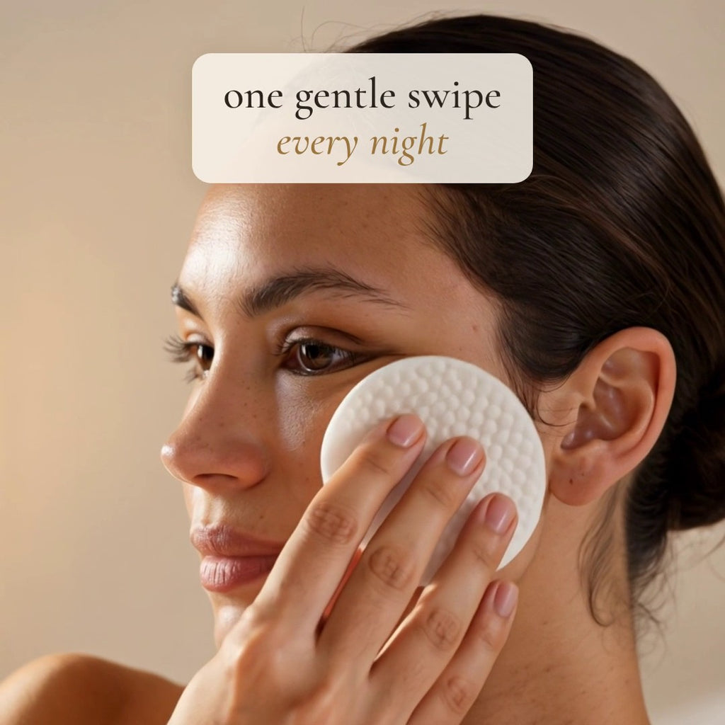 One gentle swipe every night: woman sweeping a Luminelle pad across her cheek